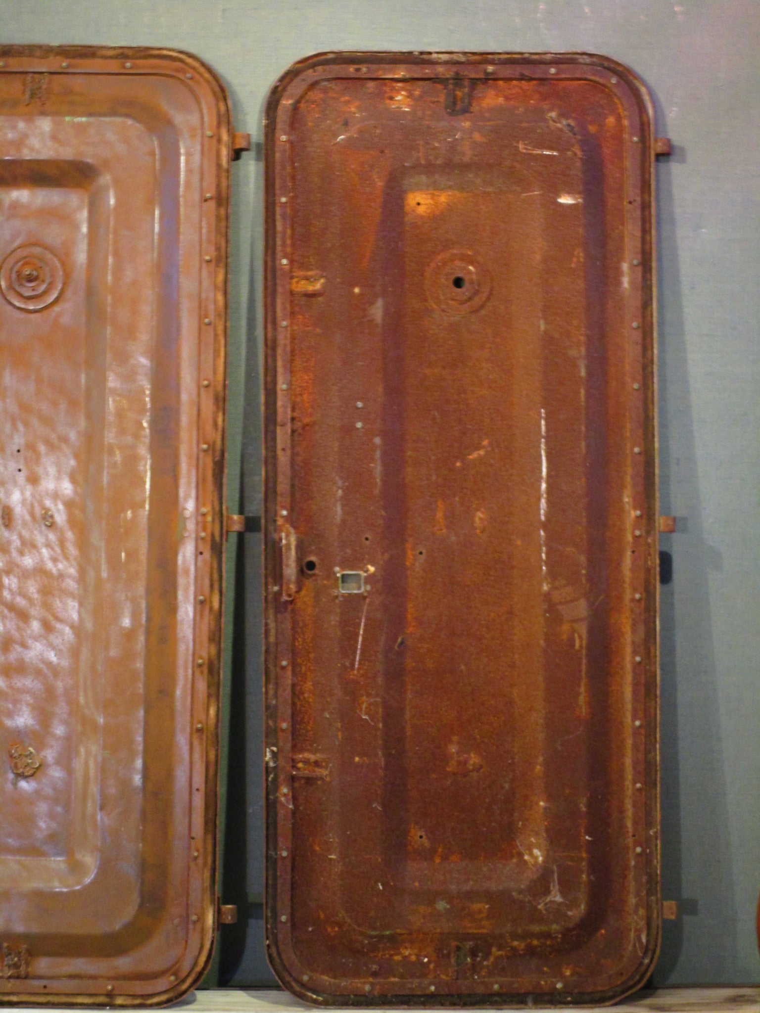 Pair of antique rustic metal boat doors