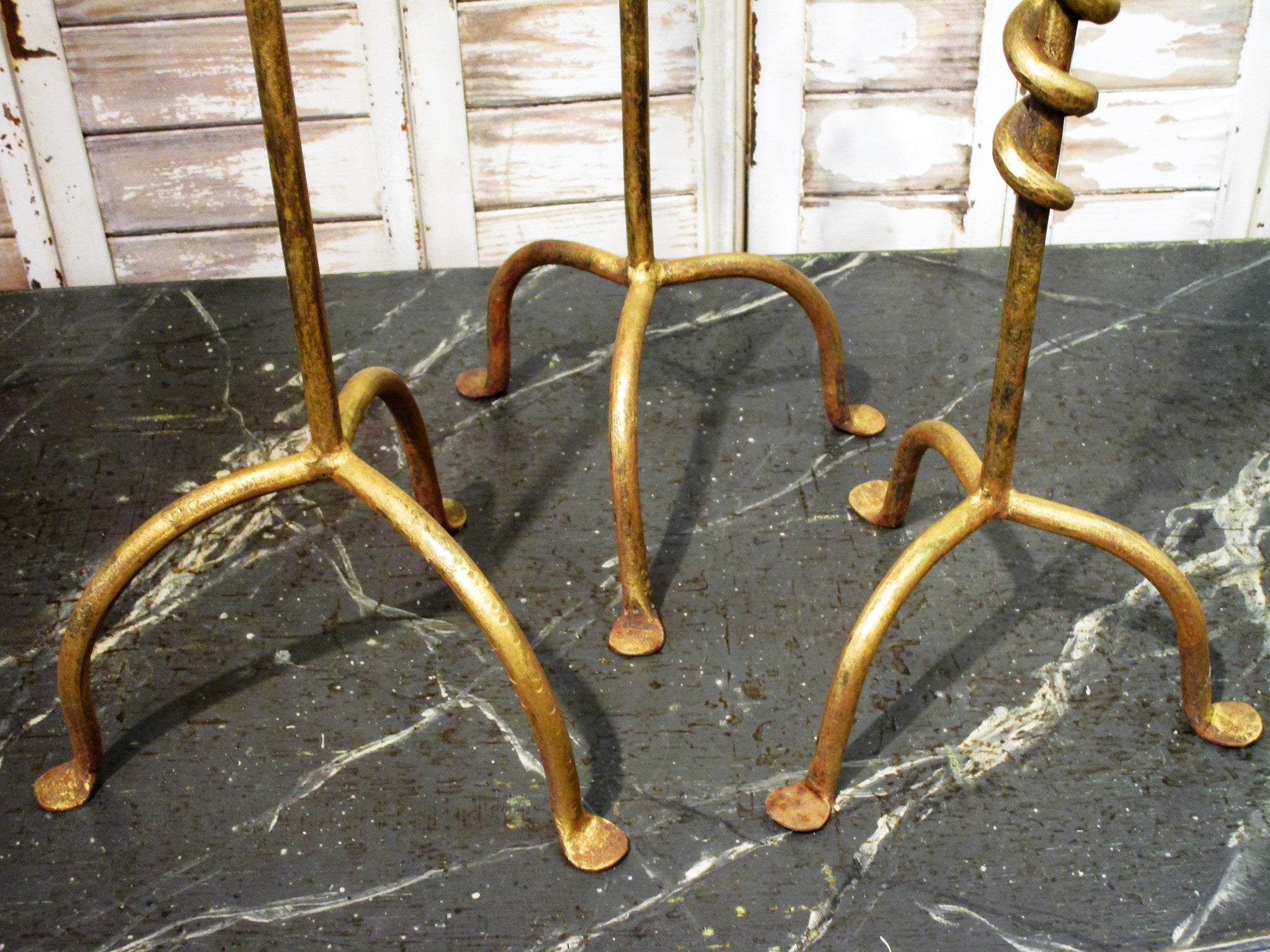 Set of three wrought iron candlesticks