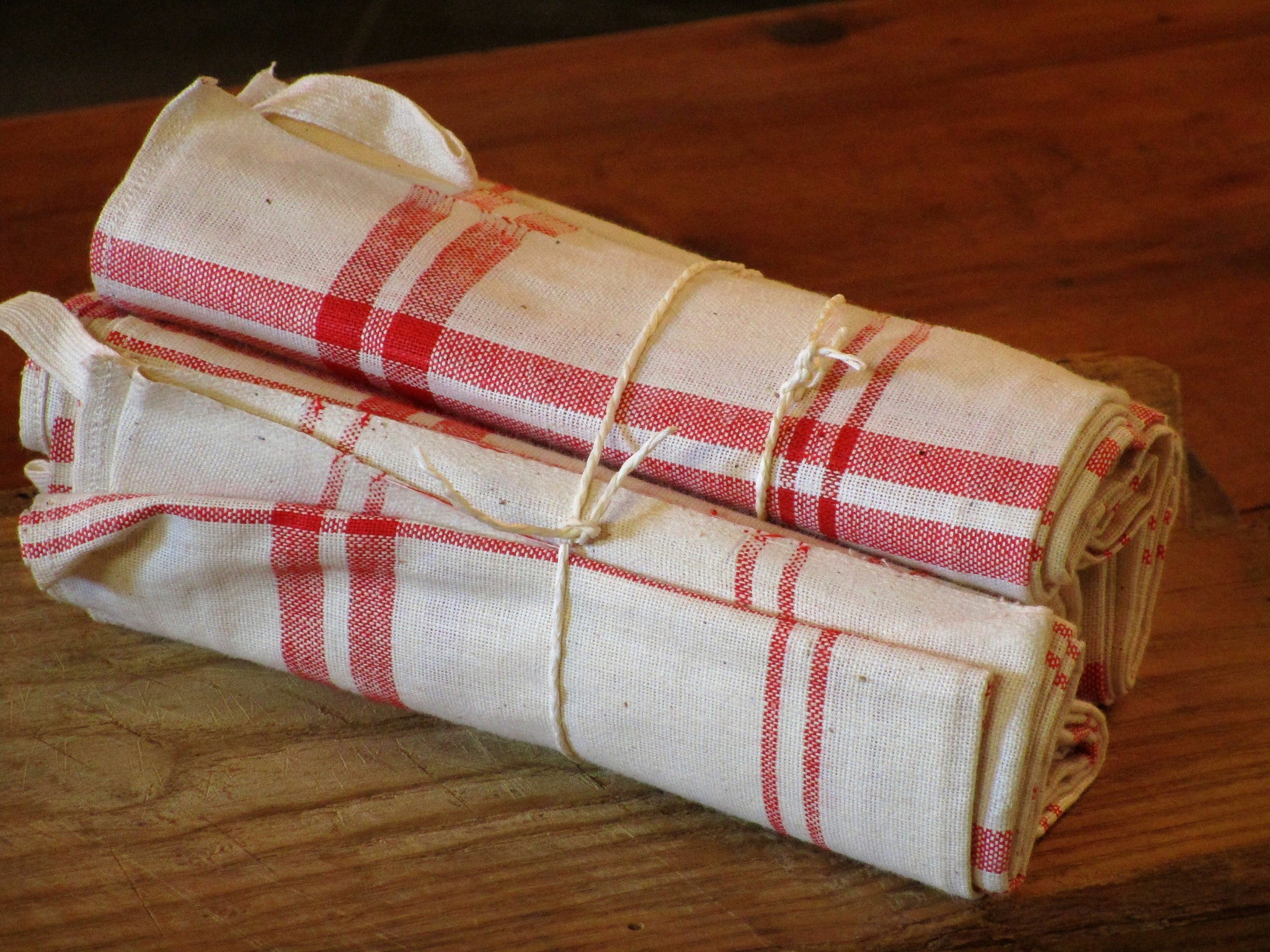 Set of six red checked tea towels