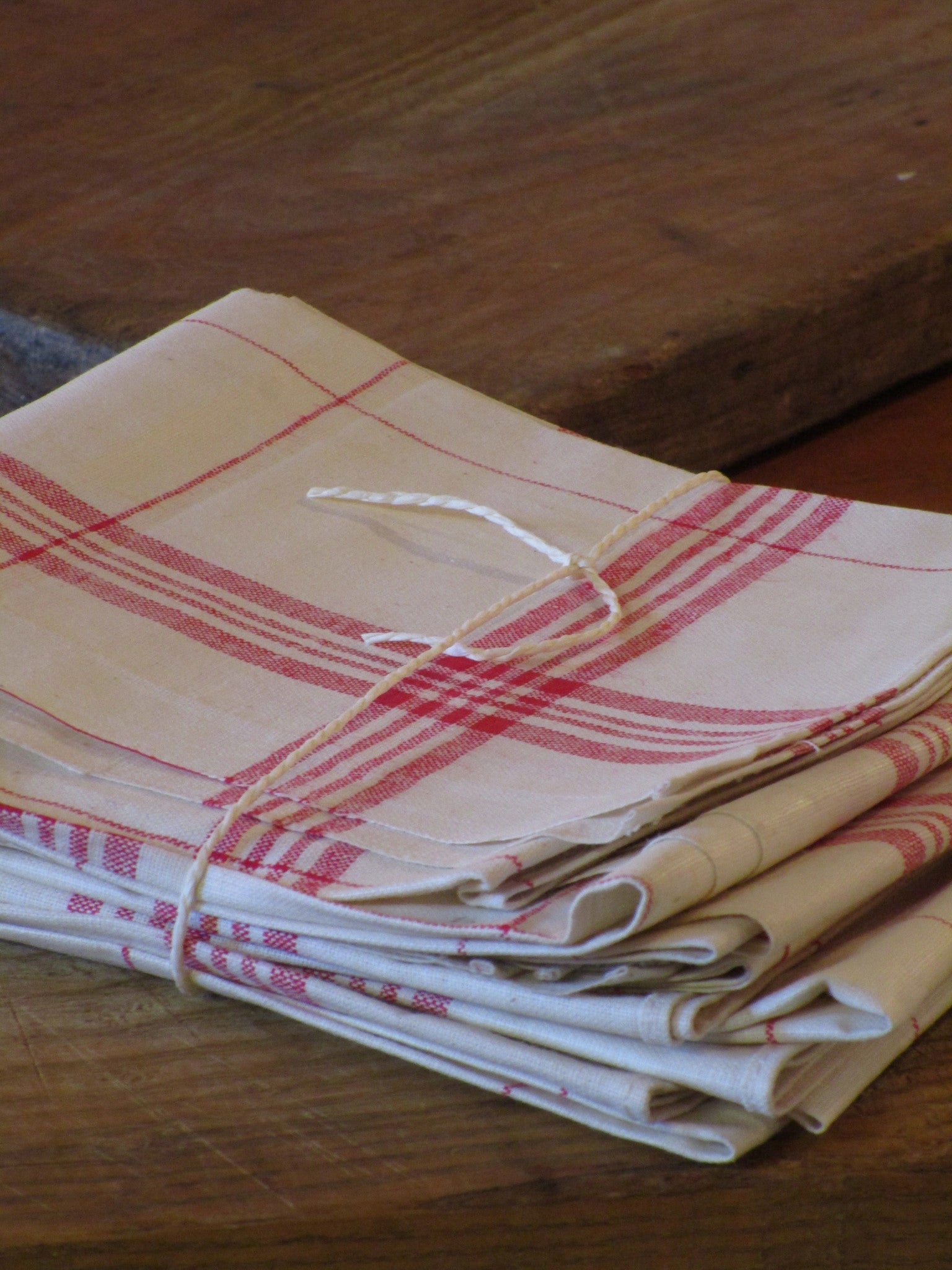 Set of six red checked tea towels