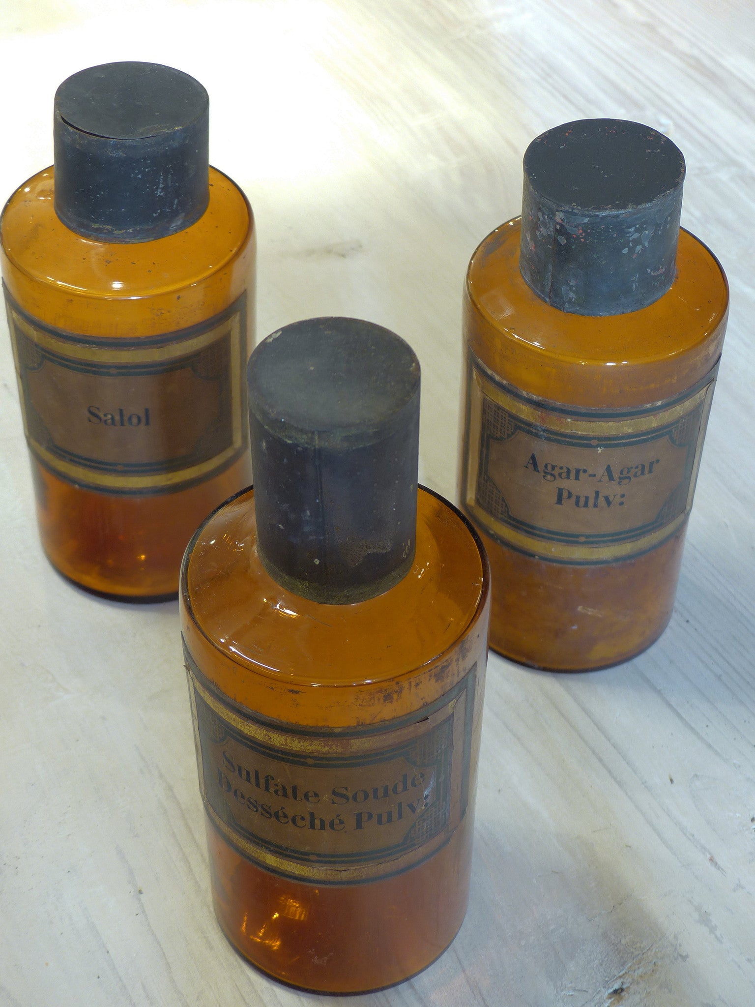 Set of three amber French Apothecary glass jars