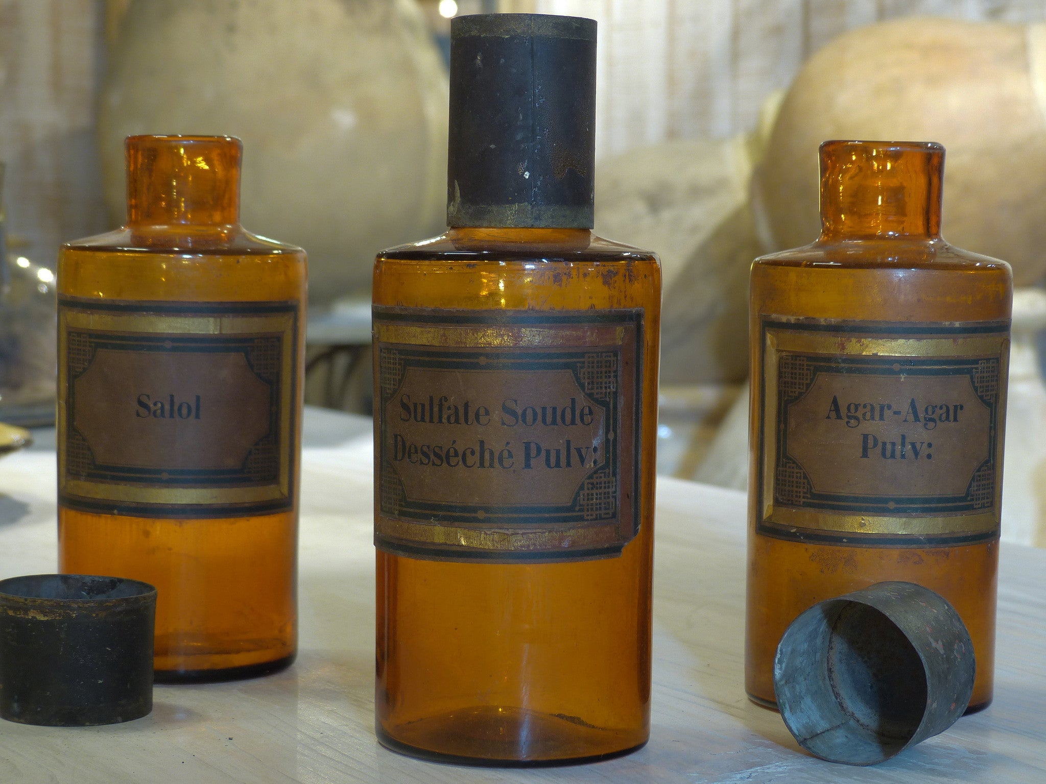 Set of three amber French Apothecary glass jars