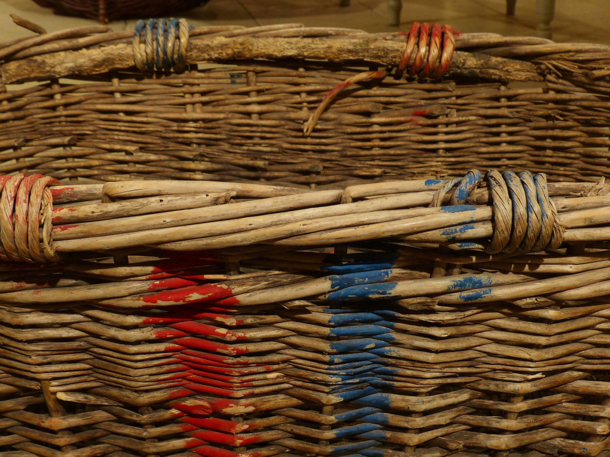 Large French wicker basket with red and blue