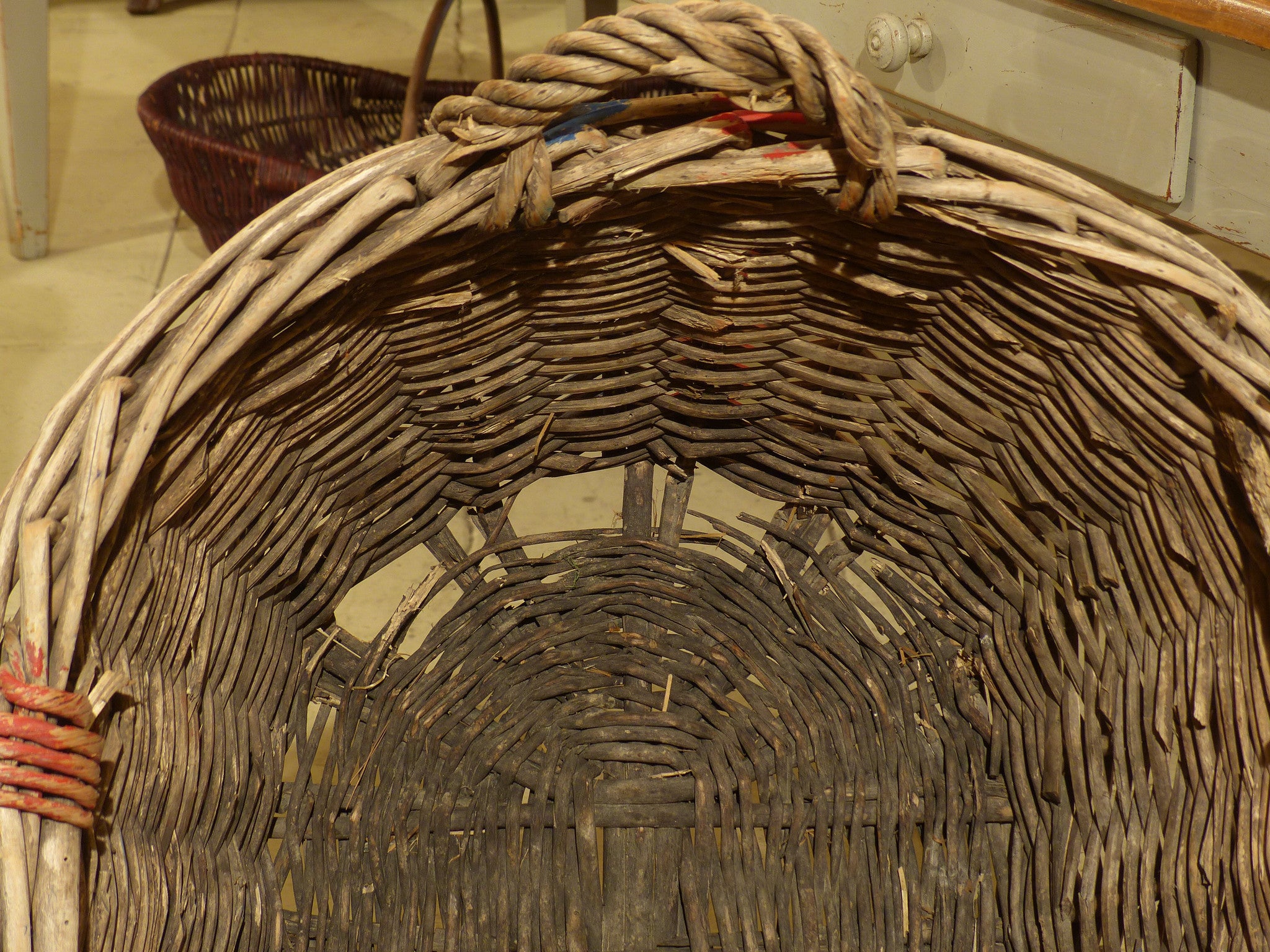 Large French wicker basket with red and blue