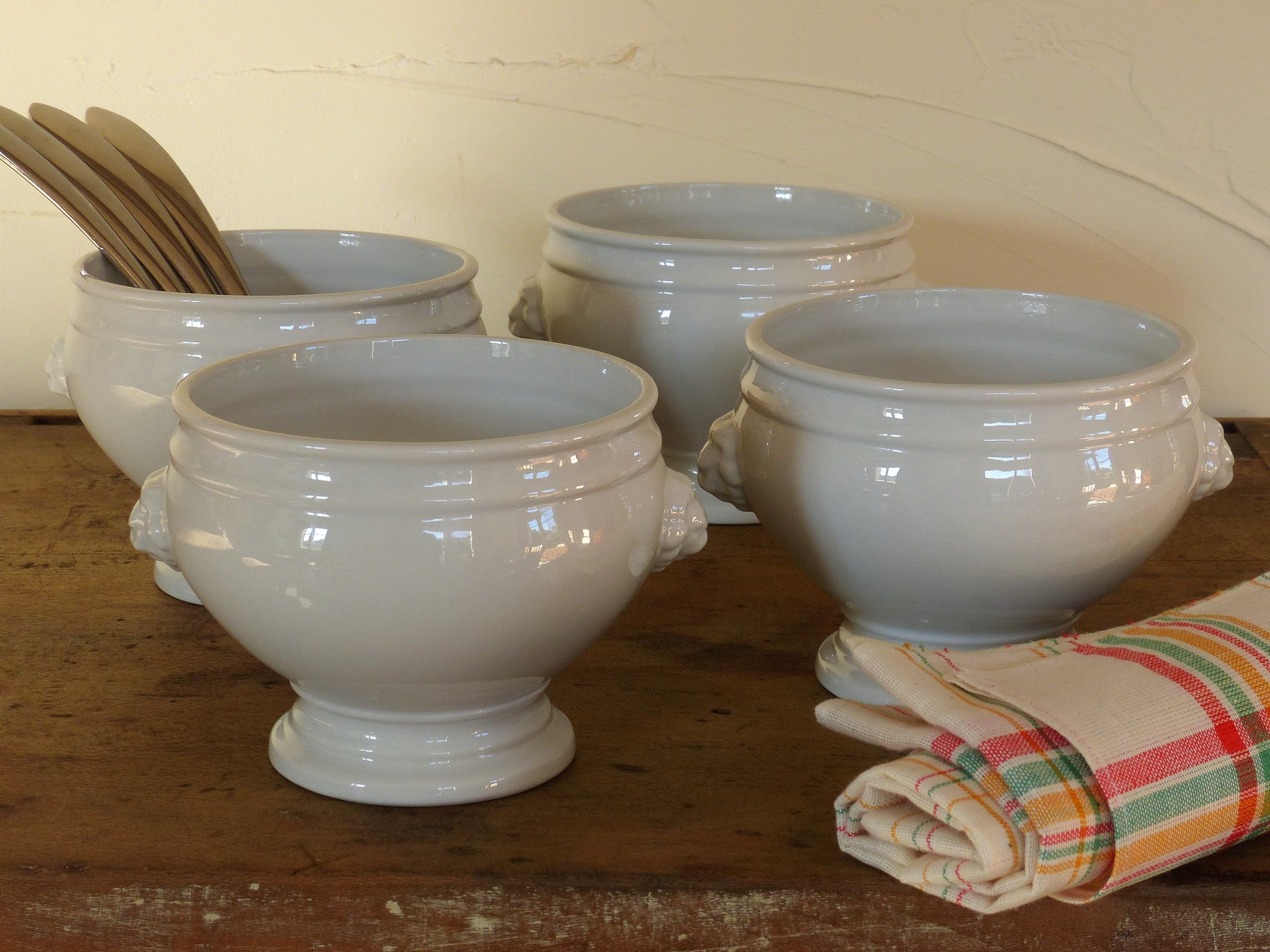 Set of four French lion head soup bowls