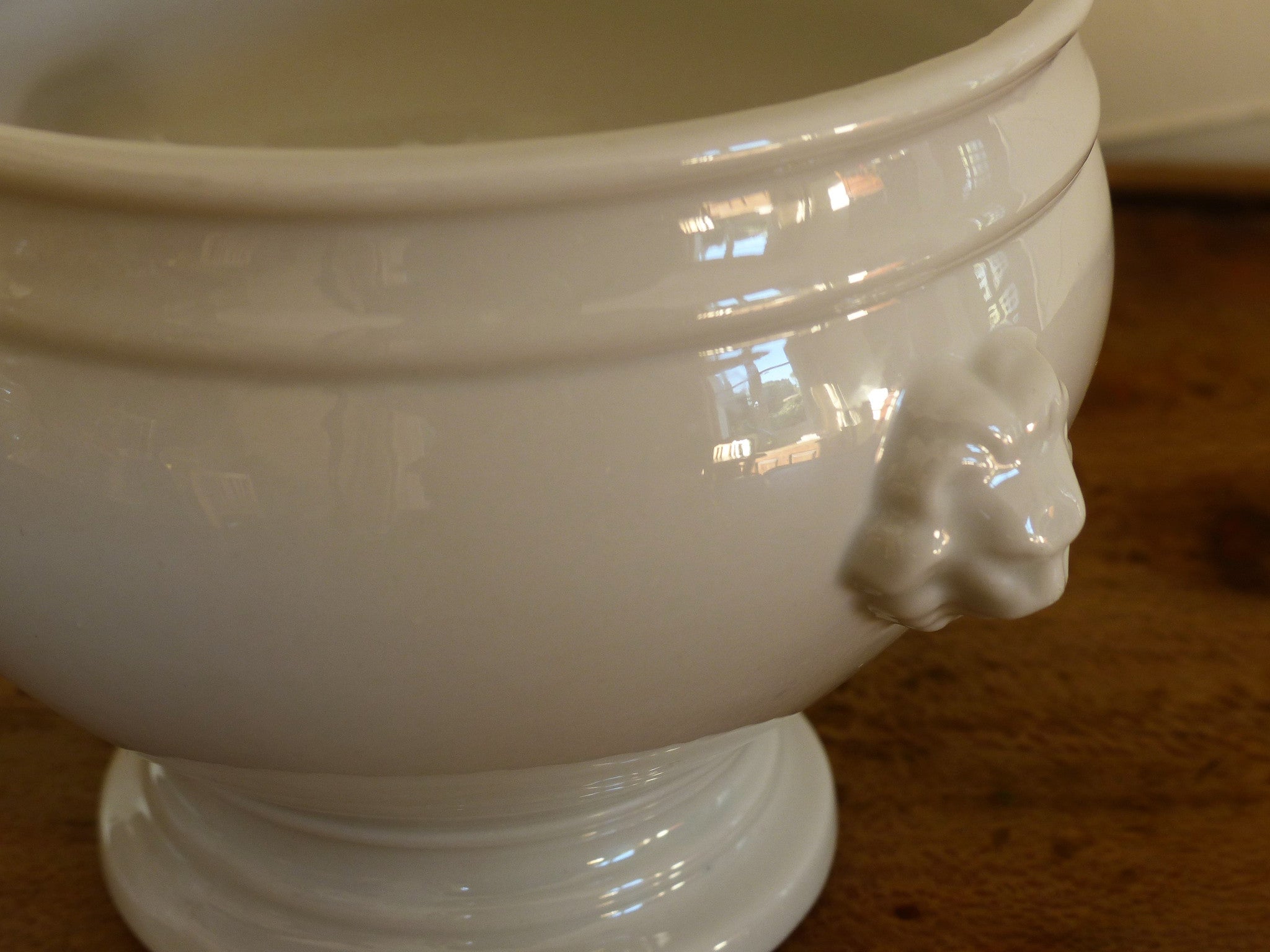 Set of four French lion head soup bowls