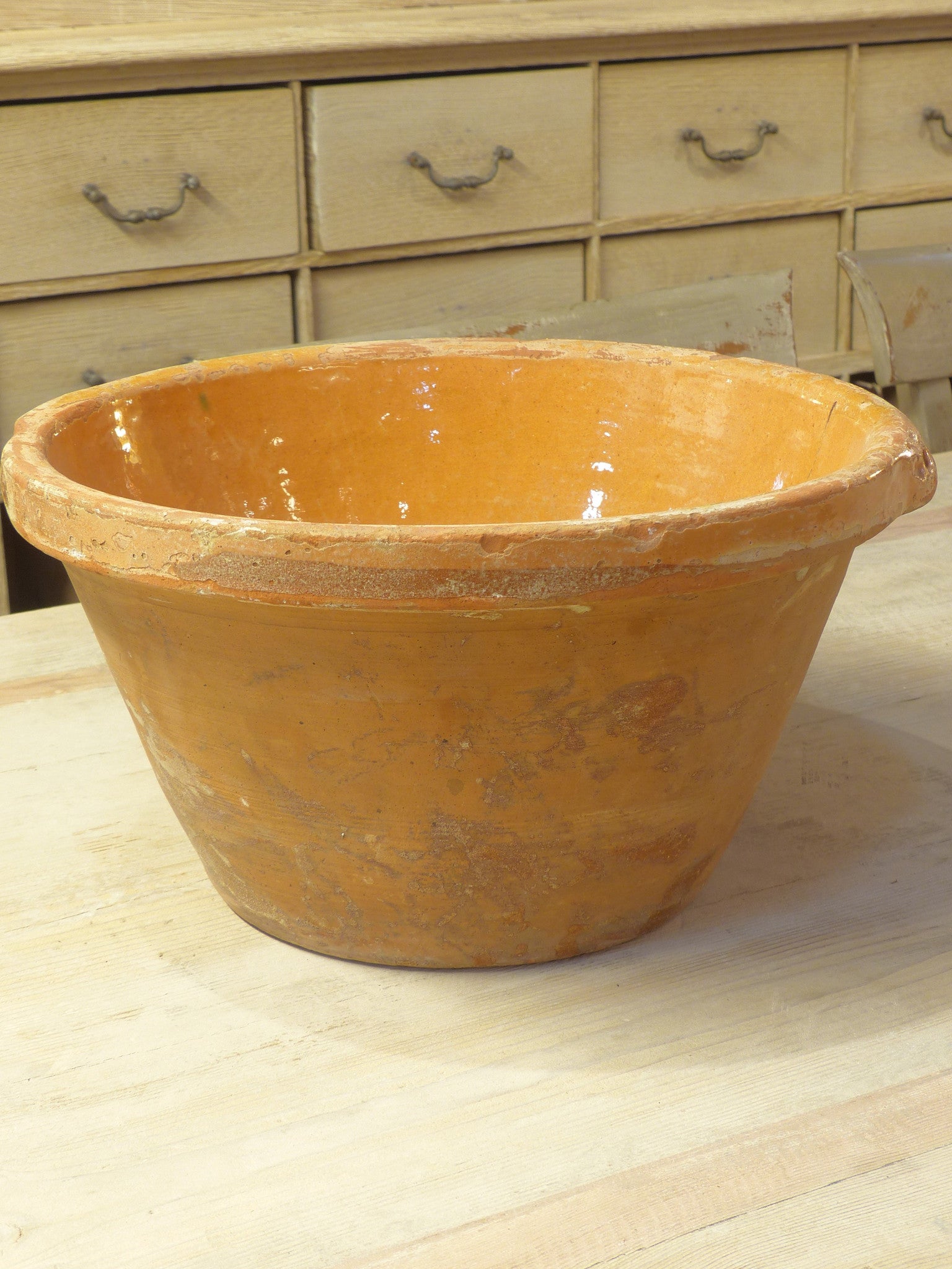 Rustic terracotta bowl with orange glaze