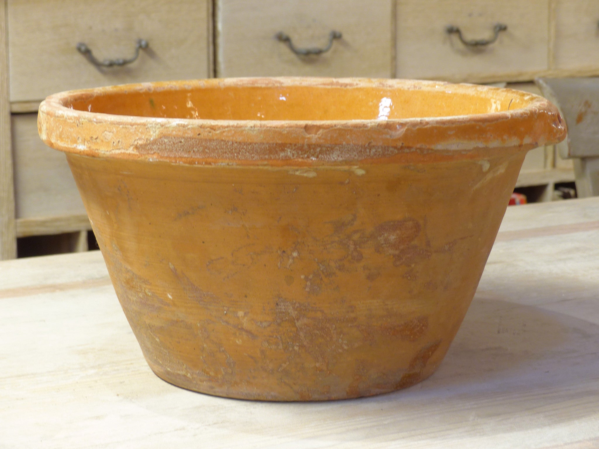 Rustic terracotta bowl with orange glaze