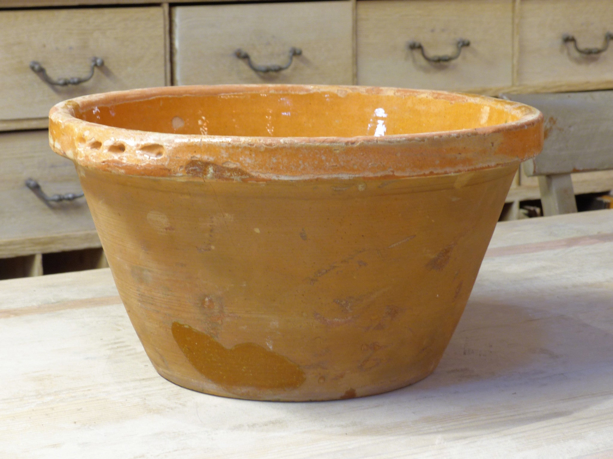 Rustic terracotta bowl with orange glaze