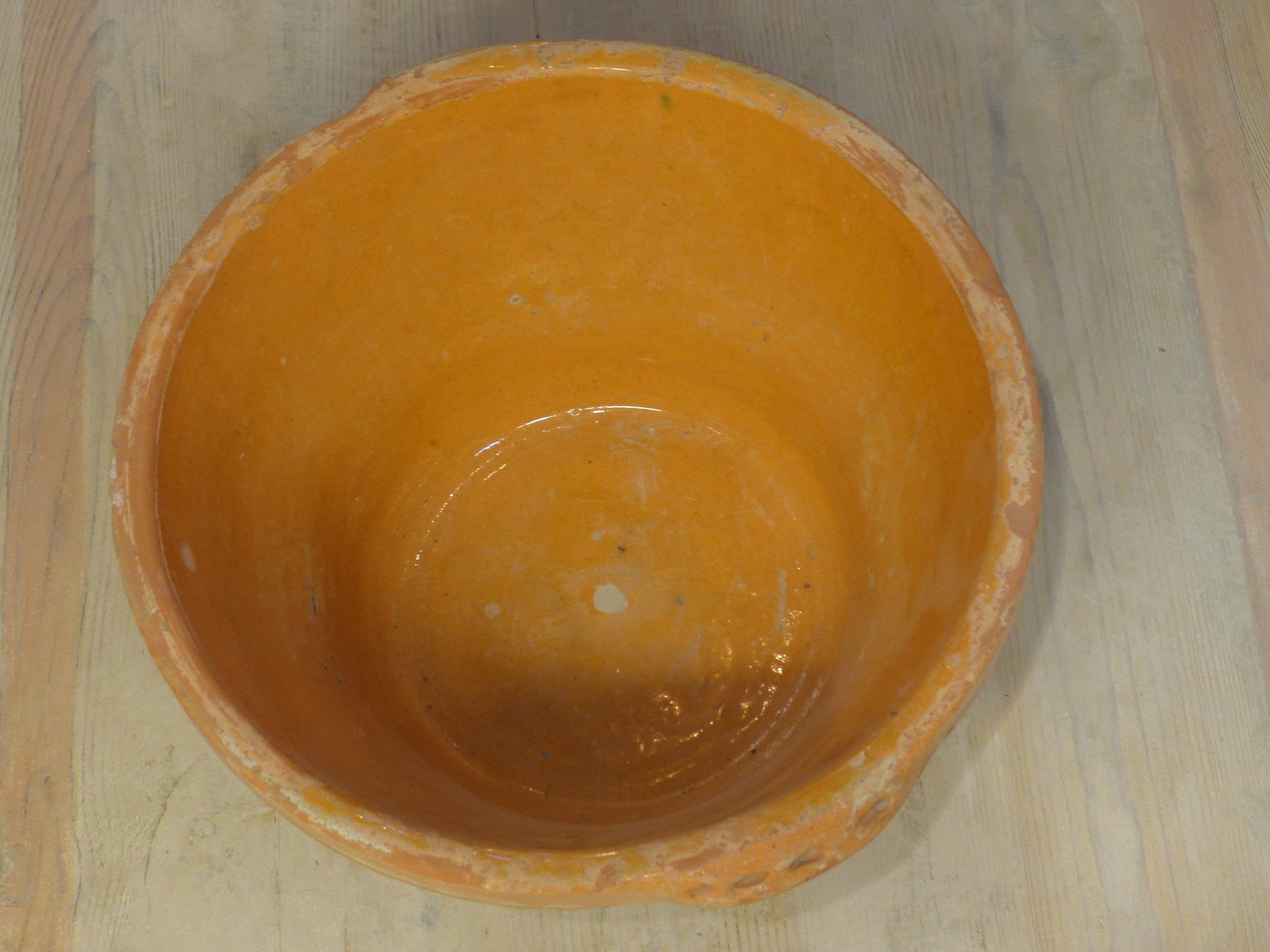 Rustic terracotta bowl with orange glaze