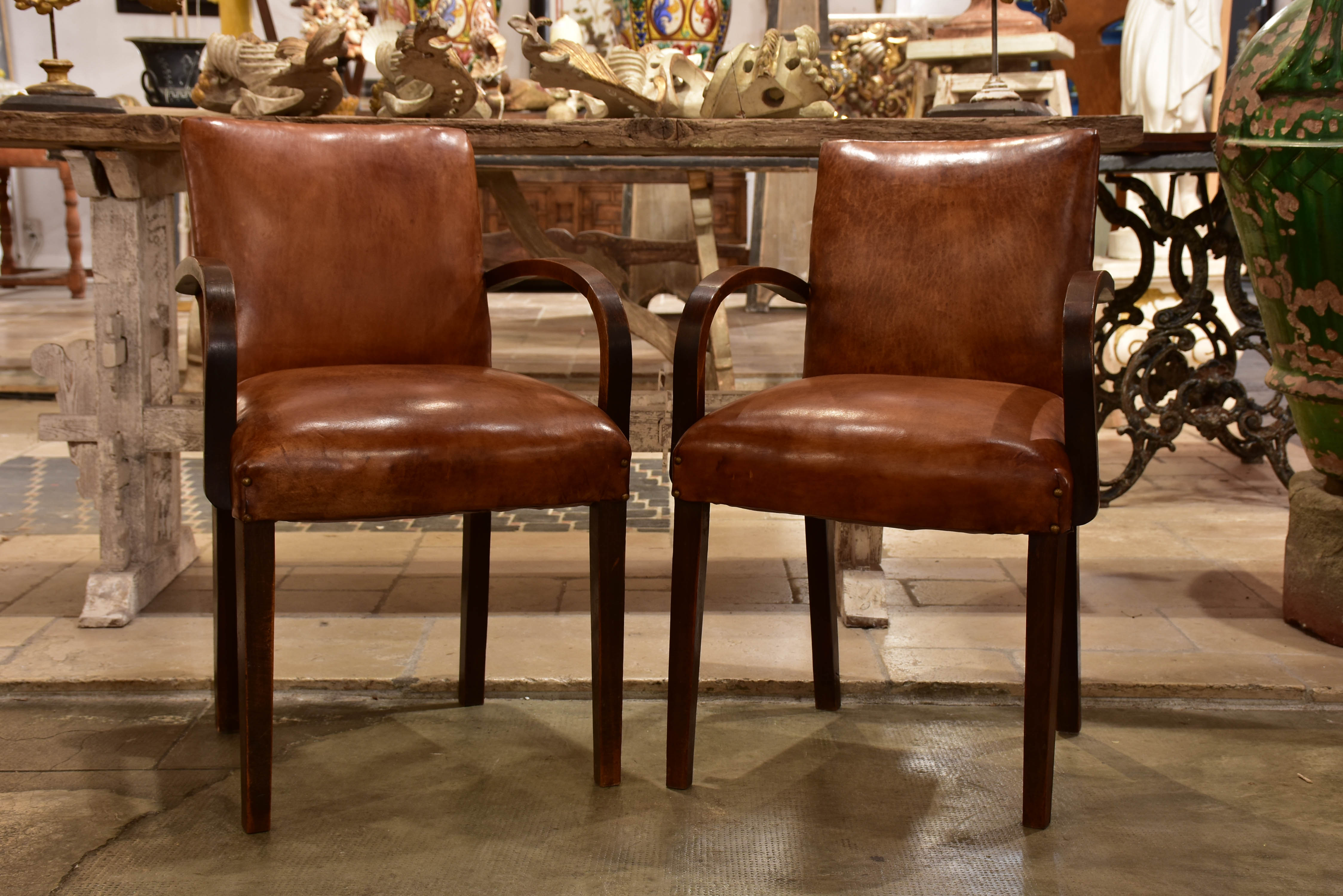 Pair of French Bridge armchairs with leather upholstery