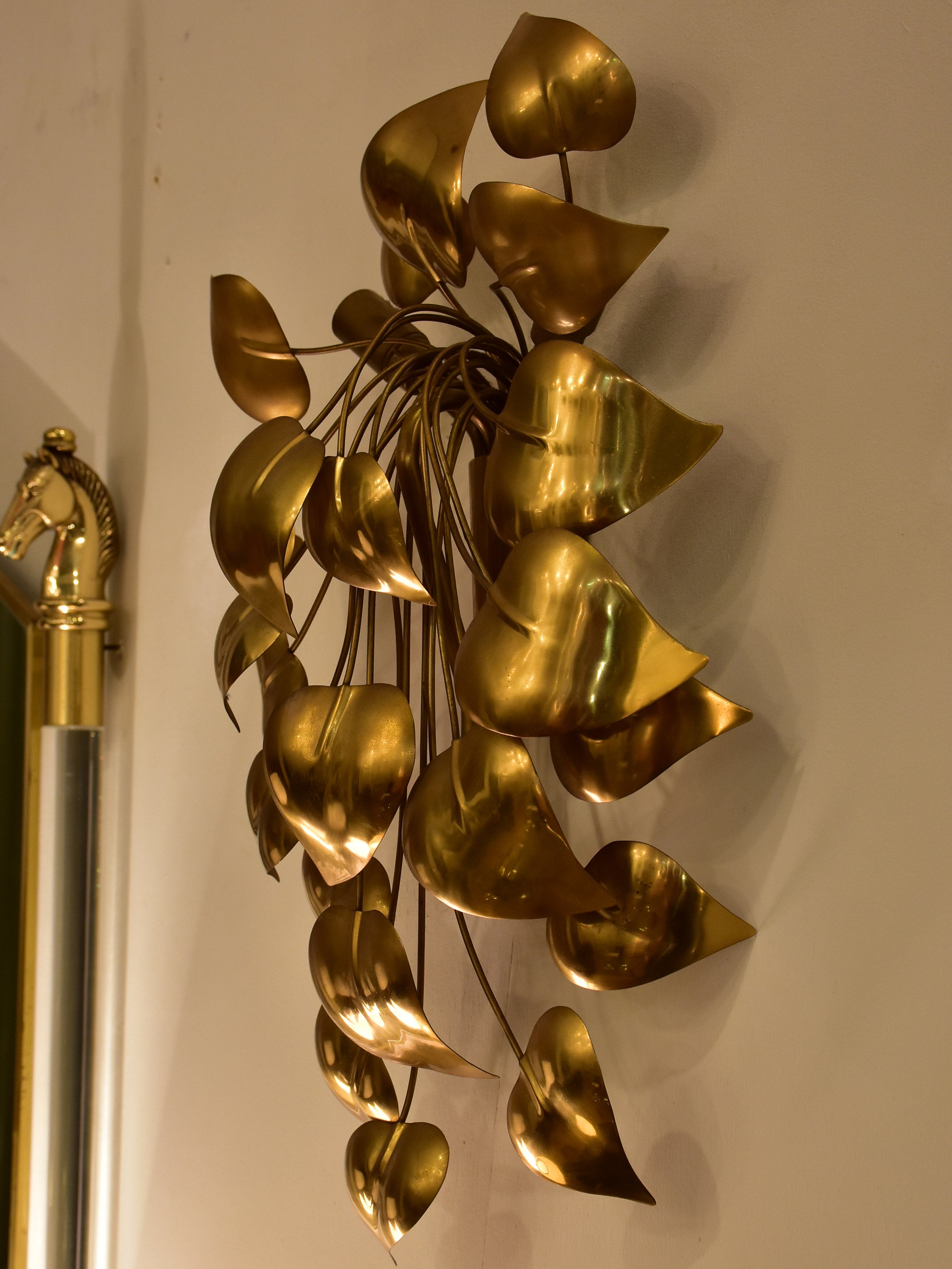 Sculptural vintage wall sconce with gold leaves